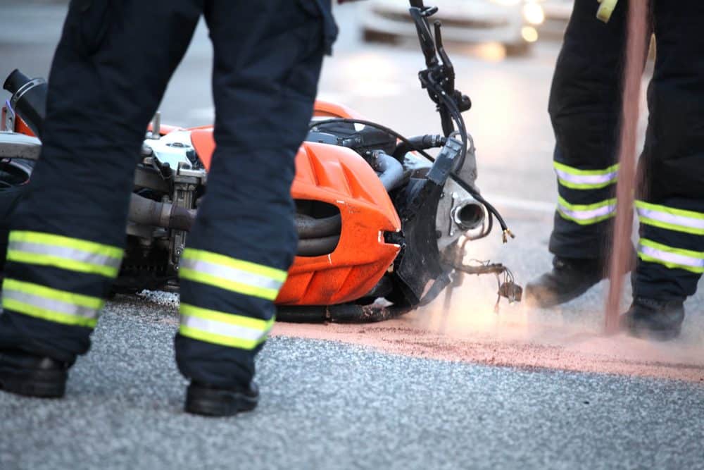 First responders cleaning up the scene of an accident.