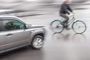 Car Striking A Man Riding A Bicycle Stock Photo