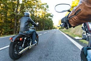 Motorcyclists Riding On Rural Road Stock Photo