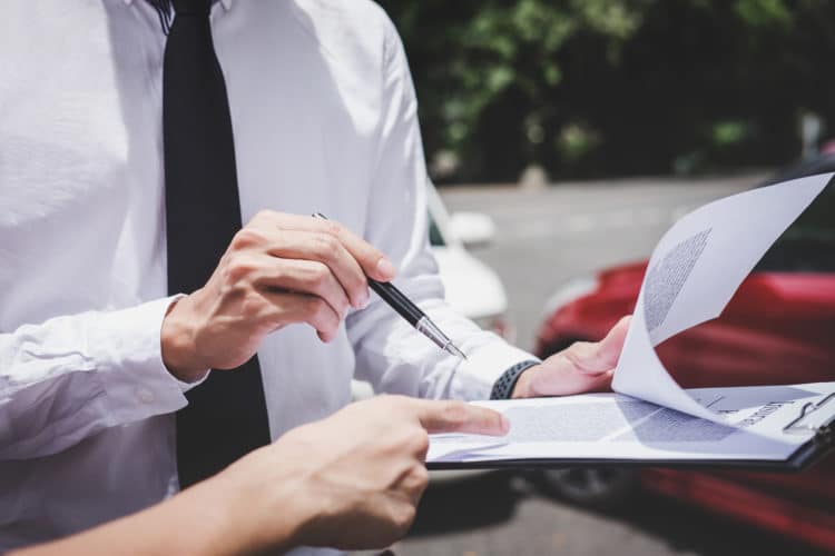 insurance adjuster evaluating a car accident