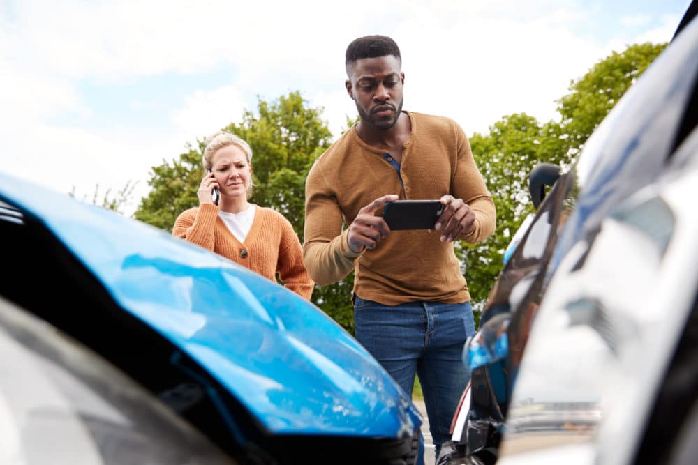 drivers collecting evidence after a Montgomery, AL, car accident